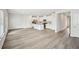 Spacious living room and kitchen combo with hardwood floors and white walls at 602 Wallace Oak Ln, Lawrenceville, GA 30045