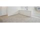 Bright loft area featuring neutral carpeting, natural light, and a crisp, neutral paint scheme at 602 Wallace Oak Ln, Lawrenceville, GA 30045