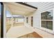 Covered patio with white columns and an exterior door to the home with the yard at 602 Wallace Oak Ln, Lawrenceville, GA 30045