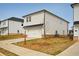 New construction, two-story home with neutral siding, a two car garage, and a clean lawn at 1260 Firefly Field Trce Trce, Lawrenceville, GA 30045