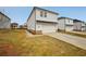 New construction, two-story home with neutral siding, a two car garage, and a clean lawn at 1260 Firefly Field Trce Trce, Lawrenceville, GA 30045