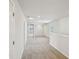 Bright and airy hallway with neutral carpet and paint, leading to multiple rooms at 1260 Firefly Field Trce Trce, Lawrenceville, GA 30045