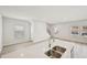 Open-concept kitchen and living area with an island, stainless steel sink and lots of natural light at 1260 Firefly Field Trce Trce, Lawrenceville, GA 30045
