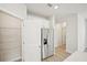 Well-lit kitchen area with stainless steel refrigerator and walk-in pantry space at 1260 Firefly Field Trce Trce, Lawrenceville, GA 30045