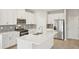 Modern kitchen with white cabinetry, stainless steel appliances, and an island with a sink at 1260 Firefly Field Trce Trce, Lawrenceville, GA 30045