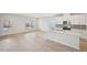 Open-concept space highlighting hardwood floors, a kitchen with a central island and abundant natural light at 1260 Firefly Field Trce Trce, Lawrenceville, GA 30045