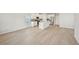 Open-concept living area featuring hardwood floors and a modern kitchen with an island and stainless steel appliances at 1260 Firefly Field Trce Trce, Lawrenceville, GA 30045