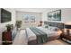 Staged main bedroom with a gray bed, modern decor, and natural light from two windows at 1260 Firefly Field Trce Trce, Lawrenceville, GA 30045