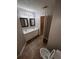 Bathroom features double sinks, tiled floor, and a toilet at 142 Benfield Cir, Cartersville, GA 30121