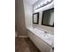 Double vanity bathroom with marble countertop and large mirrors at 142 Benfield Cir, Cartersville, GA 30121