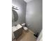 Updated bathroom with gray vanity and tile floor at 142 Benfield Cir, Cartersville, GA 30121