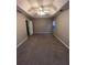 Spacious carpeted bedroom with ceiling fan and en-suite bathroom access at 142 Benfield Cir, Cartersville, GA 30121