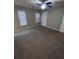 Spacious bedroom with neutral carpeting and ceiling fan at 142 Benfield Cir, Cartersville, GA 30121