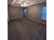 Spacious carpeted bedroom with two windows and neutral walls at 142 Benfield Cir, Cartersville, GA 30121