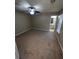 Well-lit bedroom with ceiling fan and bathroom access at 142 Benfield Cir, Cartersville, GA 30121