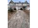 Two-story townhome with a driveway and landscaped yard at 142 Benfield Cir, Cartersville, GA 30121