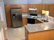 Modern kitchen with stainless steel appliances and granite countertops at 142 Benfield Cir, Cartersville, GA 30121