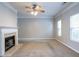 Bright living room featuring a fireplace and neutral color palette at 142 Benfield Cir, Cartersville, GA 30121