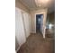Upstairs hallway with two closets and access to bedrooms at 142 Benfield Cir, Cartersville, GA 30121
