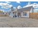 Large backyard with patio, fire pit, and wooden fence at 180 Eryn Ter, Covington, GA 30014