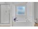 Bathroom features a soaking tub and a separate shower at 180 Eryn Ter, Covington, GA 30014