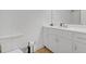 Clean bathroom with white cabinets and a quartz countertop at 180 Eryn Ter, Covington, GA 30014