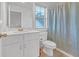 Bright bathroom with white vanity and a shower/tub combo at 180 Eryn Ter, Covington, GA 30014