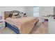 Guest bedroom with a plush carpet, large bed and window at 180 Eryn Ter, Covington, GA 30014