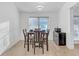 Bright dining room with hardwood floors and built-in mini-fridge at 180 Eryn Ter, Covington, GA 30014