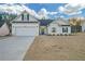 Craftsman style home with white siding, gray roof, and a two-car garage at 180 Eryn Ter, Covington, GA 30014