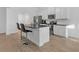 Modern kitchen with white cabinets, granite countertops, and stainless steel appliances at 180 Eryn Ter, Covington, GA 30014