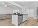 Island kitchen with stainless steel appliances and granite countertops at 180 Eryn Ter, Covington, GA 30014