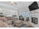 Living room with sectional sofa, fireplace and hardwood floors at 180 Eryn Ter, Covington, GA 30014