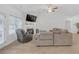 Spacious living room with a fireplace, large sectional sofa, and hardwood floors at 180 Eryn Ter, Covington, GA 30014