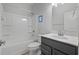 Full bathroom with a white shower/tub combo with a gray vanity and a mirror above at 48 Easton Park Blvd, Dallas, GA 30157