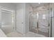 Luxurious bathroom with a marble shower and access to the bedroom, offering a private and stylish retreat at 48 Easton Park Blvd, Dallas, GA 30157