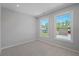 Neutral bedroom with two windows providing natural light and carpet flooring at 48 Easton Park Blvd, Dallas, GA 30157