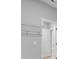 View of a walk-in closet that has white walls, a light switch, and wire shelving for optimal storage at 48 Easton Park Blvd, Dallas, GA 30157