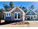 Charming new construction home featuring stone and blue siding, with a spacious driveway and manicured front lawn at 48 Easton Park Blvd, Dallas, GA 30157