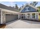 Close-up of charming two story home with craftsman elevation and a two car garage at 48 Easton Park Blvd, Dallas, GA 30157
