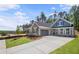 Charming two story home with craftsman elevation, lush lawn, and gray two car garage at 48 Easton Park Blvd, Dallas, GA 30157
