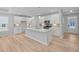 Bright kitchen features white cabinets, a spacious island, modern appliances, and stylish backsplash at 48 Easton Park Blvd, Dallas, GA 30157