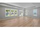 Bright living room featuring large windows and access to the backyard at 48 Easton Park Blvd, Dallas, GA 30157