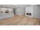 Open concept living space with modern kitchen and fireplace at 48 Easton Park Blvd, Dallas, GA 30157