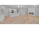 Open-concept living space showcasing a modern kitchen, cozy fireplace, and seamless flow for entertaining at 48 Easton Park Blvd, Dallas, GA 30157