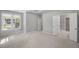 Spacious bedroom with a window and open doorway to a closet and a view into the en suite bathroom at 48 Easton Park Blvd, Dallas, GA 30157