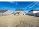 Spacious backyard with a large grassy area and privacy fence at 909 Teabiscuit Way, Mcdonough, GA 30253