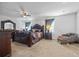 Main bedroom with plush carpet and seating area at 909 Teabiscuit Way, Mcdonough, GA 30253
