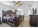 Spacious main bedroom with carpeted floors and ceiling fan at 909 Teabiscuit Way, Mcdonough, GA 30253