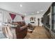 Spacious living room with hardwood floors and leather couches at 909 Teabiscuit Way, Mcdonough, GA 30253